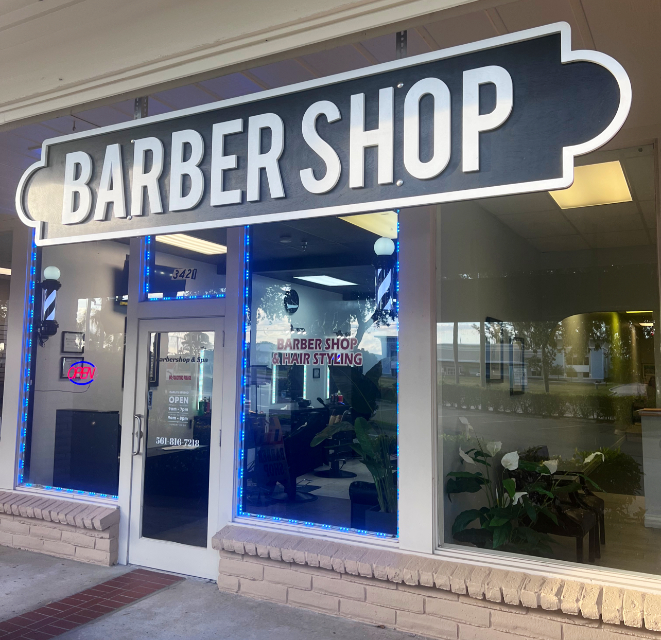 Carlis Barbershop storefront at 3421 Woolbright Rd